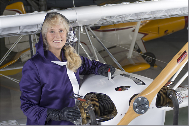 Penny Hamilton as Penny the Pilot beside an aircraft